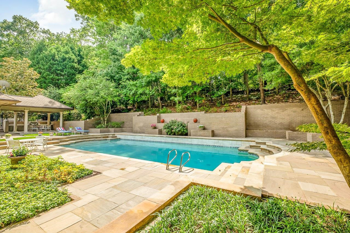 24107 Cherry Drive Chapel Hill, NC 27517 - Photo 44 of 46 a view of swimming pool with lawn chairs and plants
