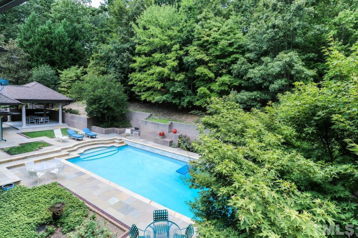 24107 Cherry Drive Chapel Hill, NC 27517 - Photo 45 of 46 a view of a swimming pool with lounge chair