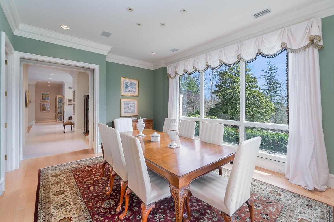24107 Cherry Drive Chapel Hill, NC 27517 - Photo 10 of 46 a view of a dining room with furniture window and wooden floor
