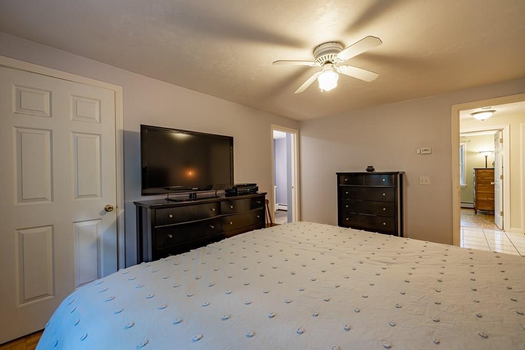 101 Shepard Road Sturbridge, MA 01566 - Photo 13 of 42 a bedroom with a bed and a flat screen tv