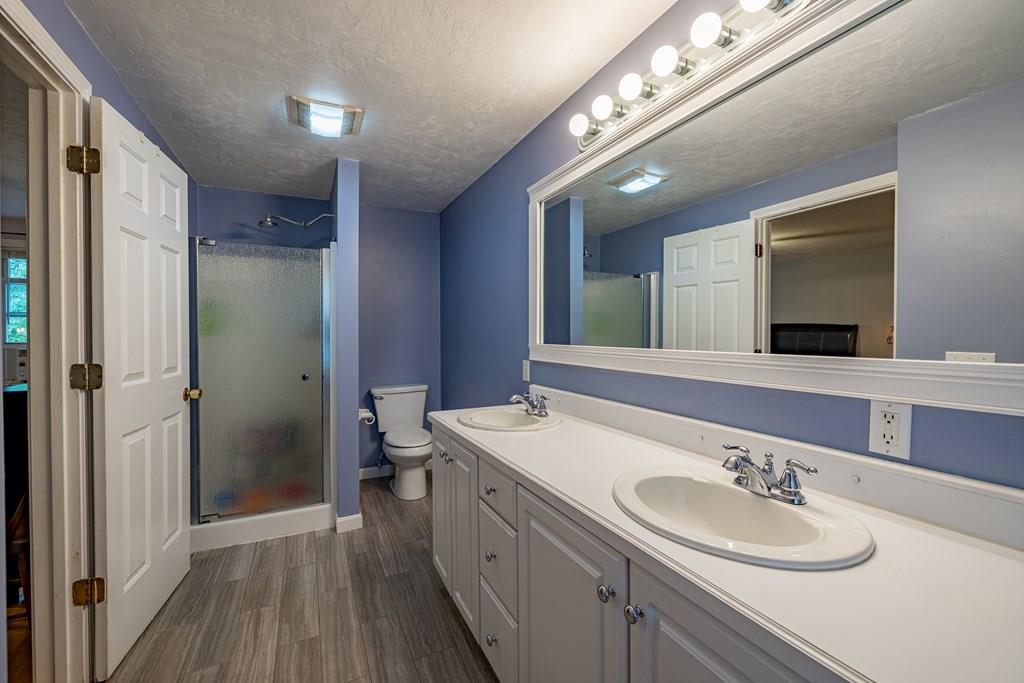 101 Shepard Road Sturbridge, MA 01566 - Photo 17 of 42 a bathroom with a sink double vanity and a mirror