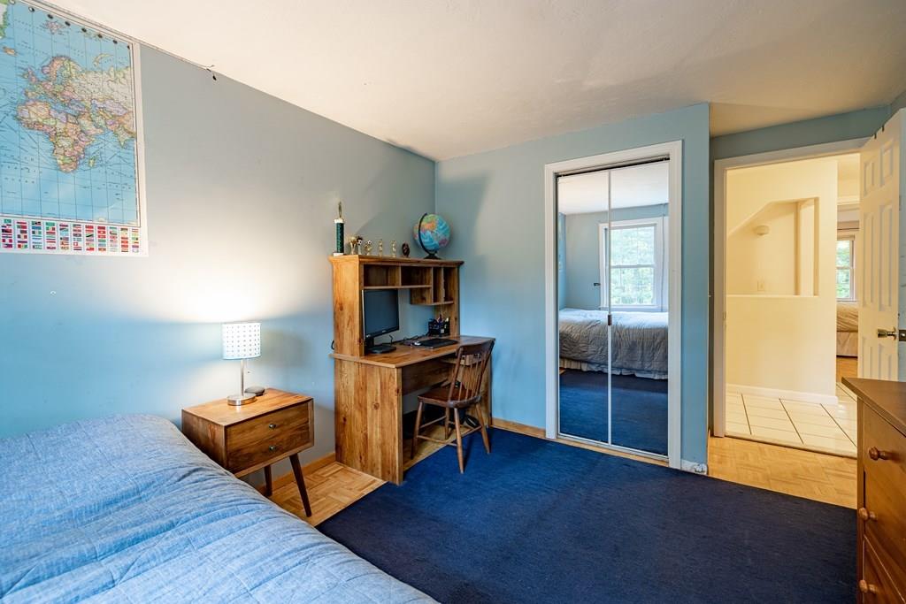 101 Shepard Road Sturbridge, MA 01566 - Photo 19 of 42 a room with furniture and a lamp
