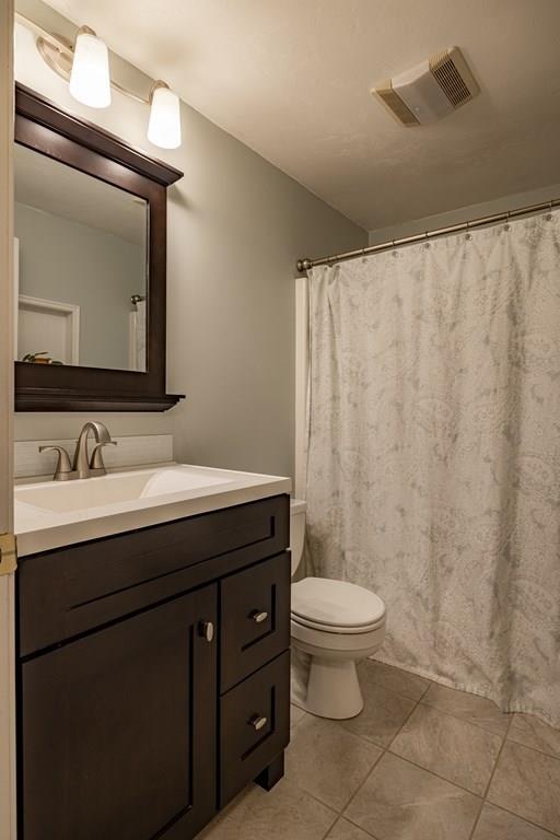 101 Shepard Road Sturbridge, MA 01566 - Photo 20 of 42 a bathroom with a granite countertop sink a toilet and a mirror