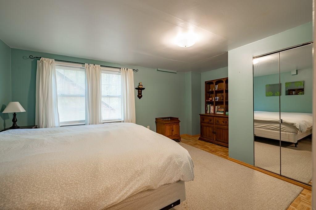 101 Shepard Road Sturbridge, MA 01566 - Photo 21 of 42 a bedroom with a bed and a large window