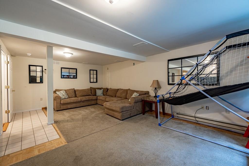 101 Shepard Road Sturbridge, MA 01566 - Photo 28 of 42 a living room with furniture and wooden floor