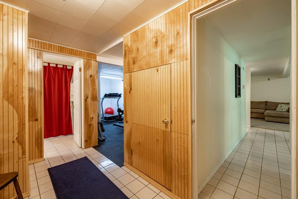 101 Shepard Road Sturbridge, MA 01566 - Photo 30 of 42 a view of a hallway with bathroom and wooden floor