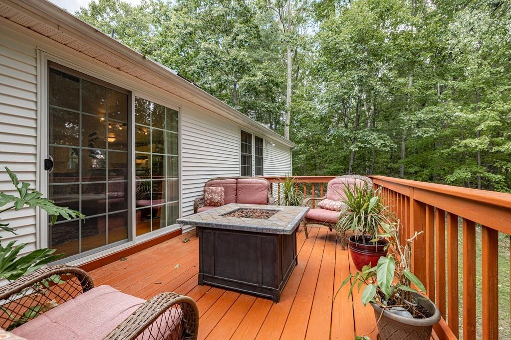 101 Shepard Road Sturbridge, MA 01566 - Photo 33 of 42 a view of a roof deck with couches and wooden floor