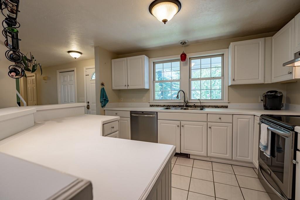 101 Shepard Road Sturbridge, MA 01566 - Photo 6 of 42 a kitchen with a stove a sink and a refrigerator