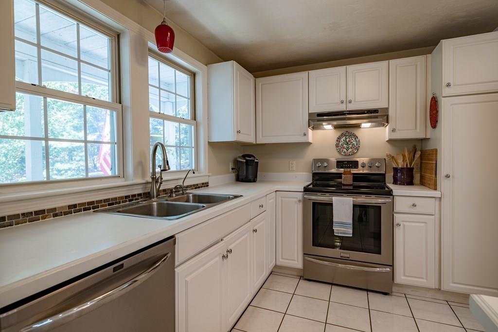 101 Shepard Road Sturbridge, MA 01566 - Photo 7 of 42 a kitchen with a sink stove and cabinets