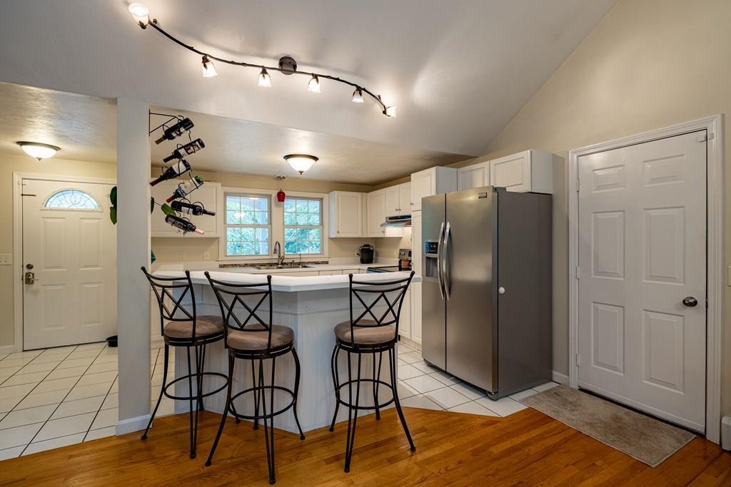101 Shepard Road Sturbridge, MA 01566 - Photo 9 of 42 a kitchen with stainless steel appliances granite countertop a refrigerator and a sink