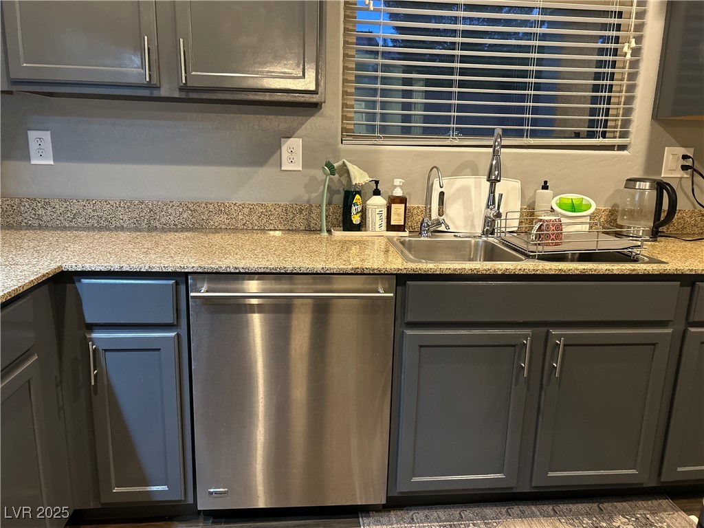 8977 Melridge Road Las Vegas, NV 89148 - Photo 13 of 35 Bar featuring a sink and dishwasher