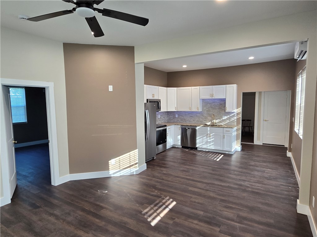 28 Ames Street Seneca, SC 29678 - Photo 22 of 22 An open floorplan seamlessly connects the versatile living area to the modern kitchen.
