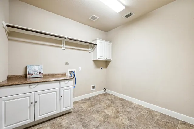 a view of a storage and utility room with closet