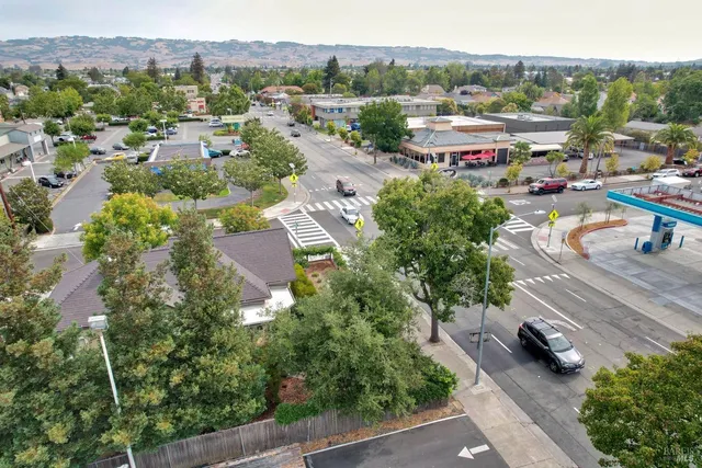 a view of a park with iron fence
