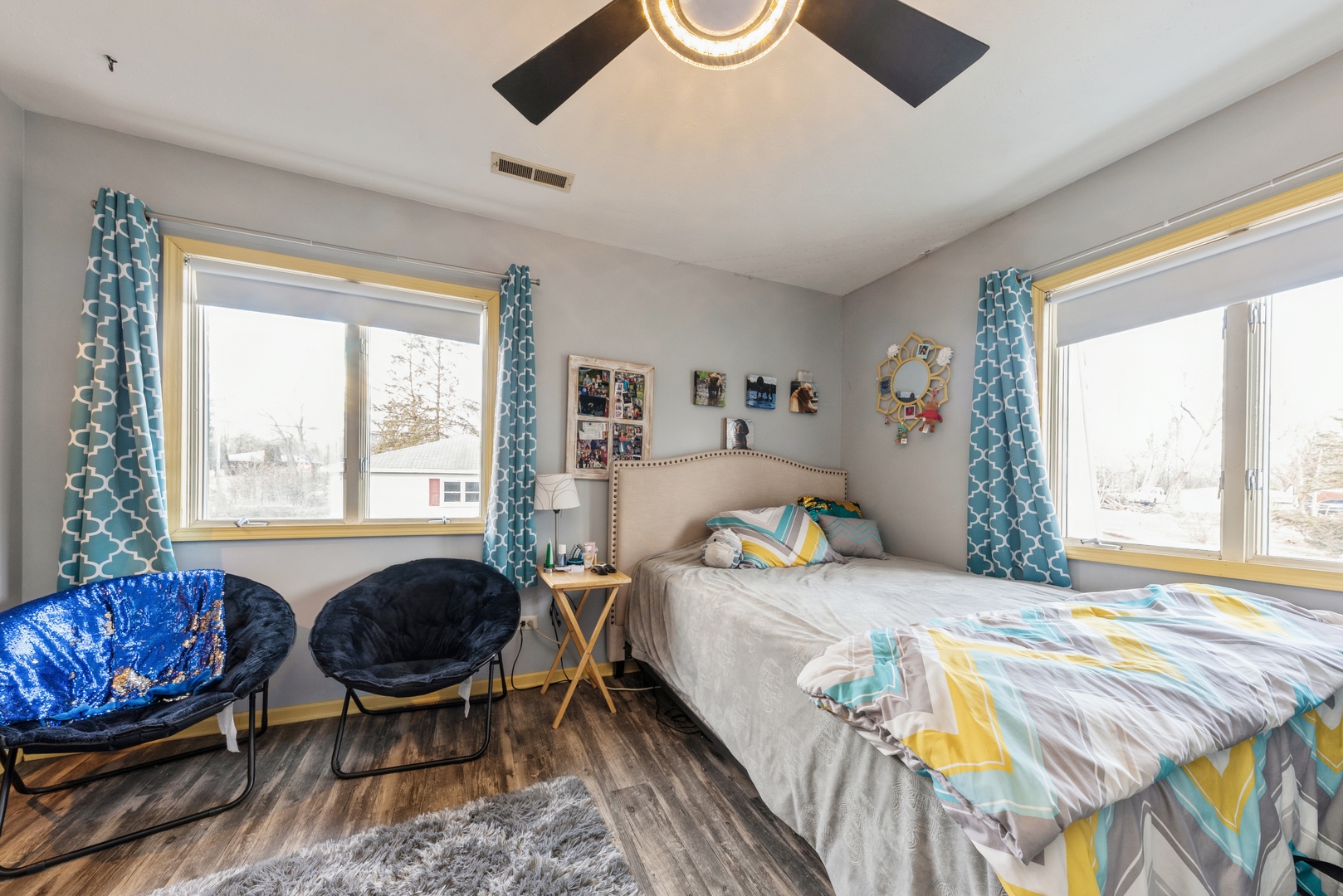 8314 Riverway Drive Cary, IL 60013 - Photo 11 of 12 a bedroom that has a bed and a chair