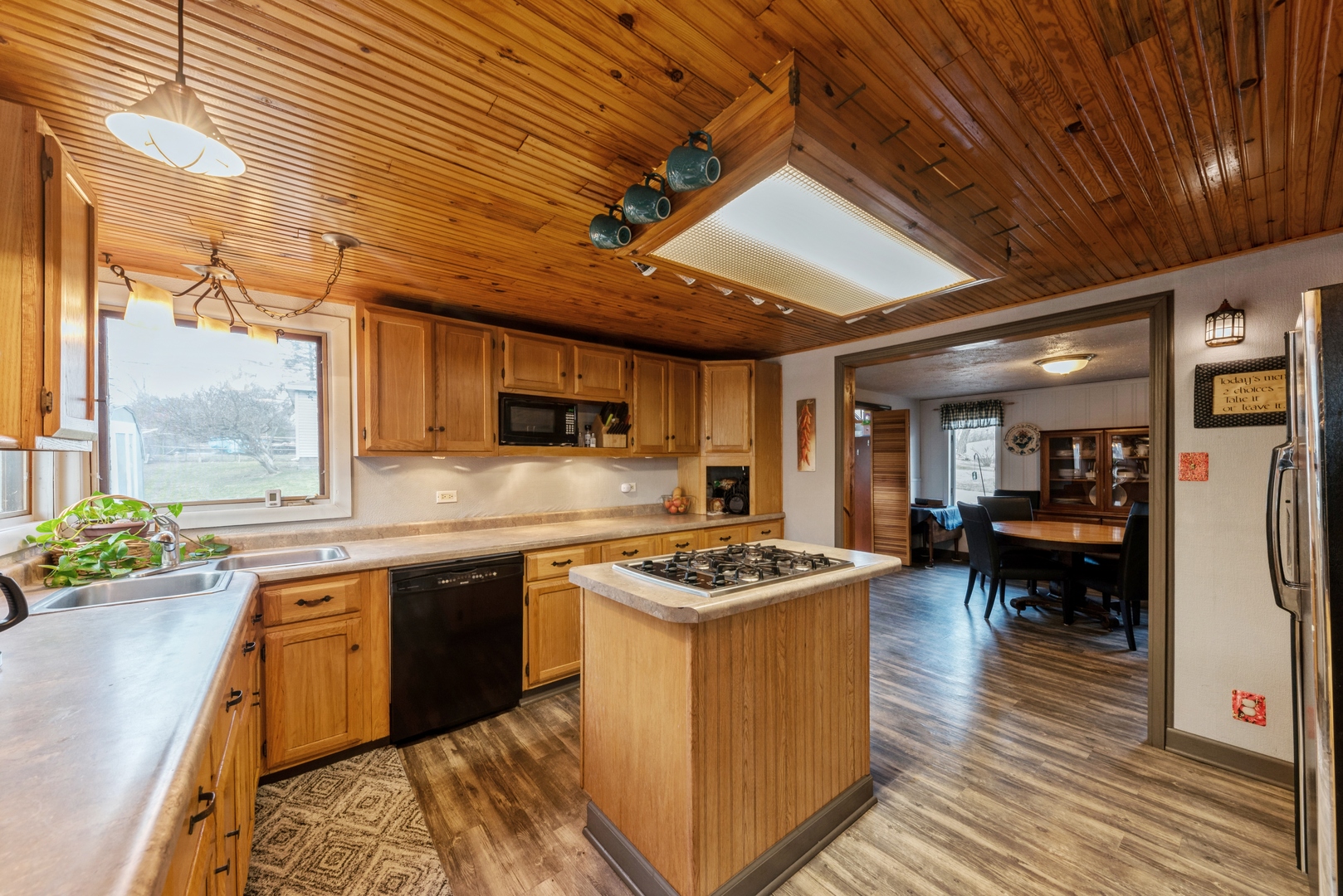 8314 Riverway Drive Cary, IL 60013 - Photo 3 of 12 a kitchen with stainless steel appliances granite countertop a stove and a refrigerator