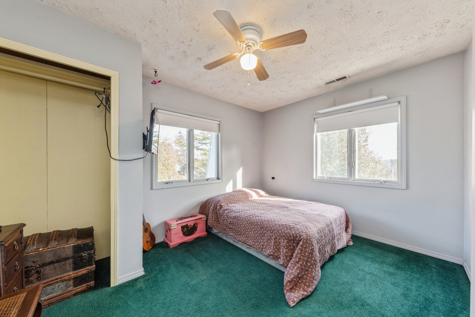 8314 Riverway Drive Cary, IL 60013 - Photo 9 of 12 a bedroom with a bed and a window