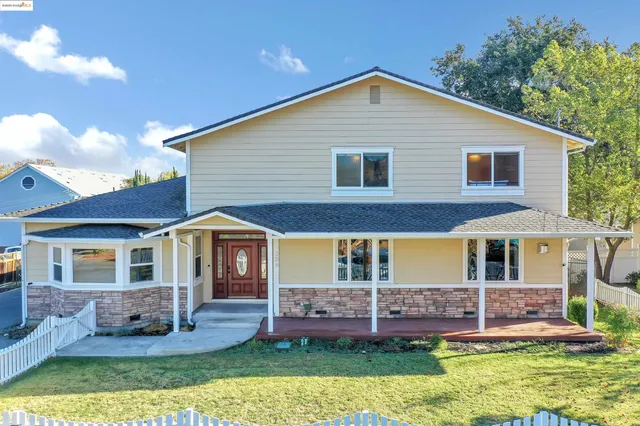 front view of a house with a yard