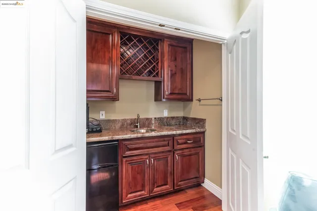 a view of a livingroom with furniture and wooden floor