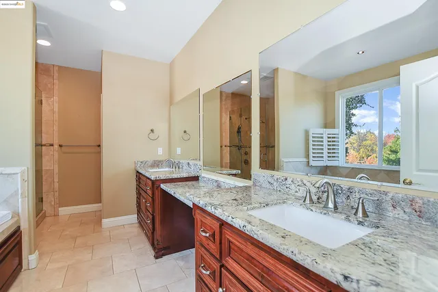 a bedroom with a bed and a television