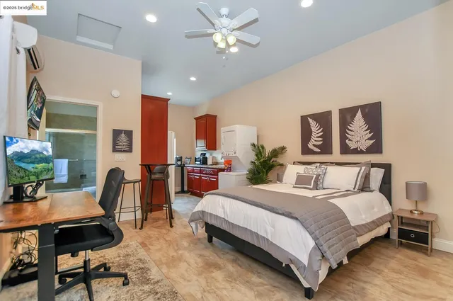 a kitchen with granite countertop a sink a stove and cabinets