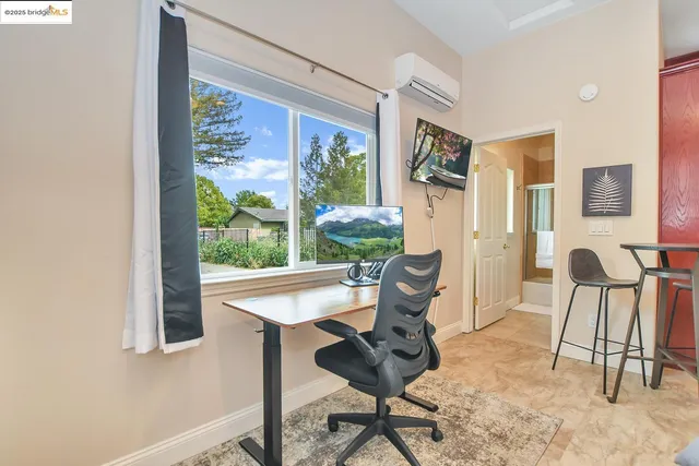 an aerial view of a house with a garden and swimming pool