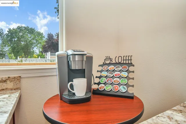 a bedroom with bed and a chandelier