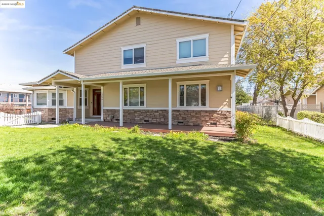 a kitchen with stainless steel appliances granite countertop sink stove and refrigerator