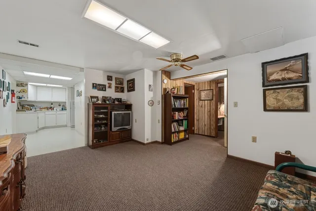 a view of a livingroom with furniture and closet
