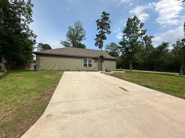 a view of house with yard
