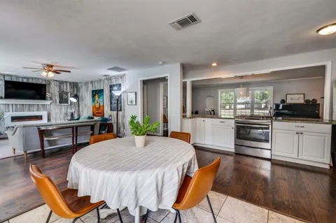 a open kitchen with dining table and chairs