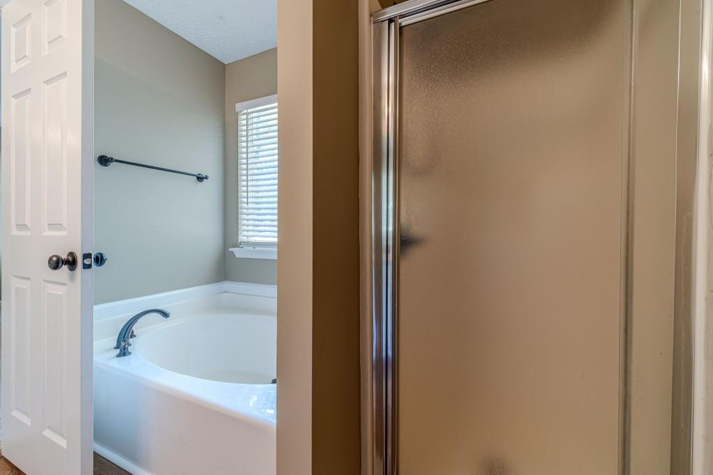701 Woodland Ridge Drive Monroe, GA 30656 - Photo 26 of 39 a bathroom with a bathtub