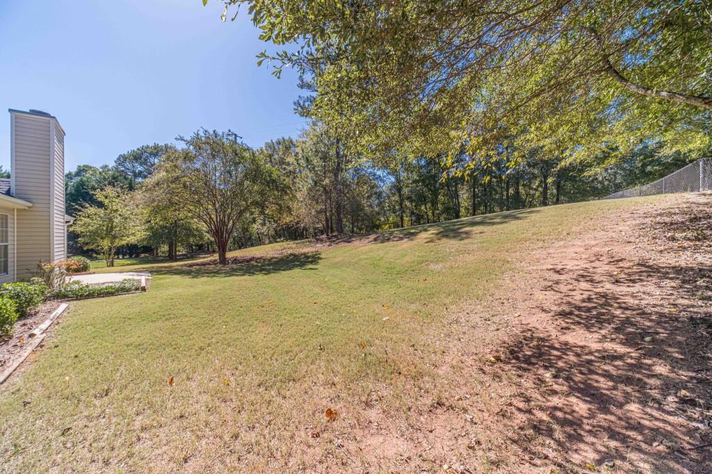 701 Woodland Ridge Drive Monroe, GA 30656 - Photo 32 of 39 a view of a yard with trees