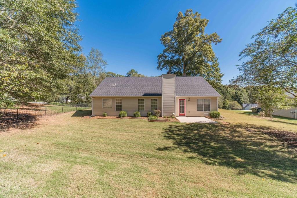 701 Woodland Ridge Drive Monroe, GA 30656 - Photo 34 of 39 a front view of a house with a yard