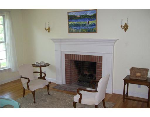 3 Circle Road Darien, CT 06820 - Photo 8 of 20 a living room with furniture and a fireplace