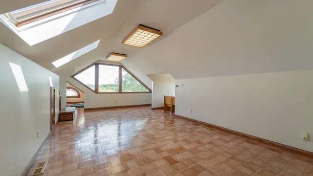 a living room with furniture and a hard wood floor