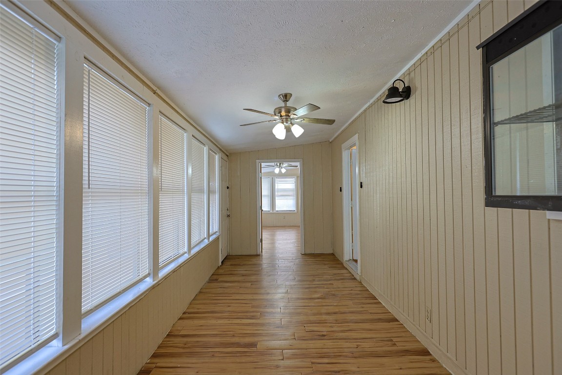 111 Branch View Drive Kyle, TX 78640 - Photo 12 of 27 a view of a hallway with wooden floor and staircase