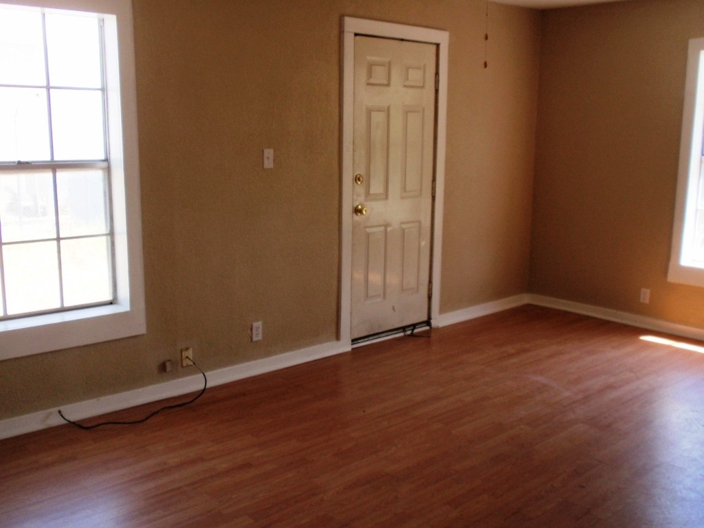 111 Branch View Drive Kyle, TX 78640 - Photo 23 of 27 an empty room with wooden floor and windows