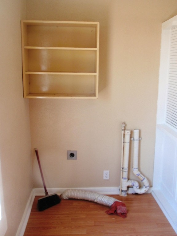 111 Branch View Drive Kyle, TX 78640 - Photo 24 of 27 a room with water heater and a wooden floor