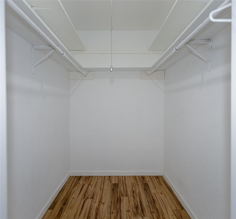 111 Branch View Drive Kyle, TX 78640 - Photo 10 of 27 a view of a room with wooden floor and white walls