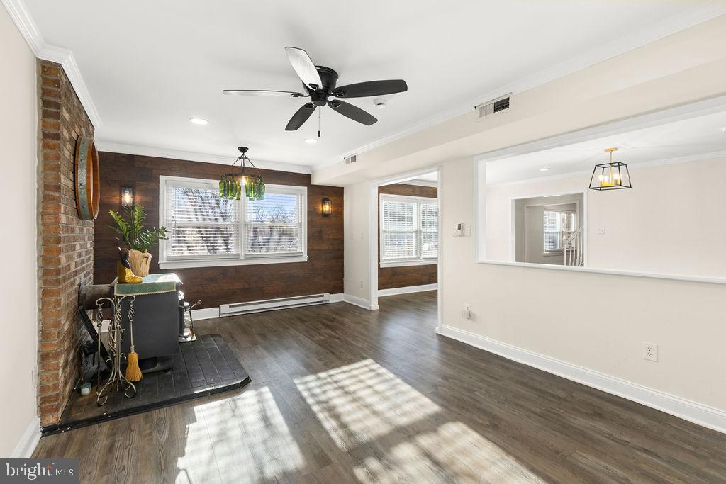 503 South Maple Court Sterling, VA 20164 - Photo 14 of 43 a living room with furniture and a floor to ceiling window