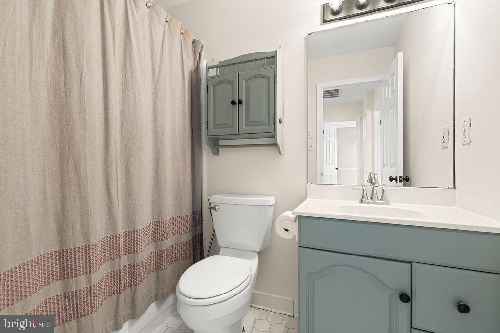 503 South Maple Court Sterling, VA 20164 - Photo 19 of 43 a bathroom with a sink a toilet and shower