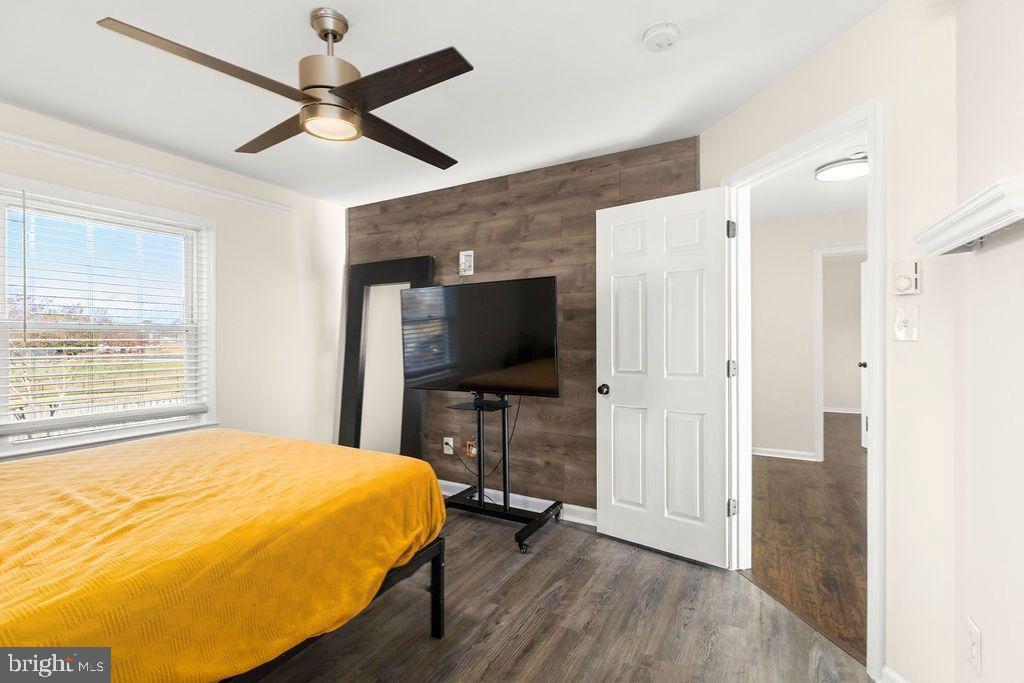 503 South Maple Court Sterling, VA 20164 - Photo 20 of 43 a bedroom with a bed and a flat screen tv