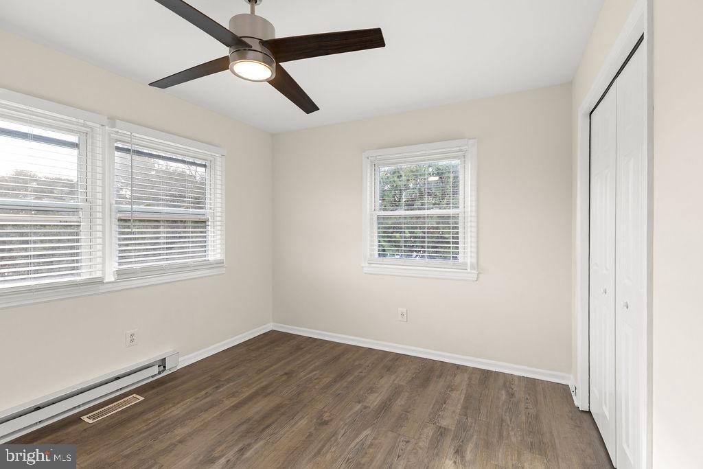 503 South Maple Court Sterling, VA 20164 - Photo 22 of 43 a view of an empty room with wooden floor and a window