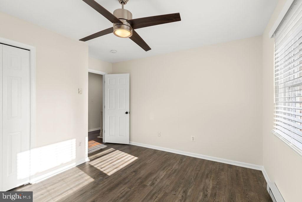 503 South Maple Court Sterling, VA 20164 - Photo 23 of 43 an empty room with wooden floor and windows