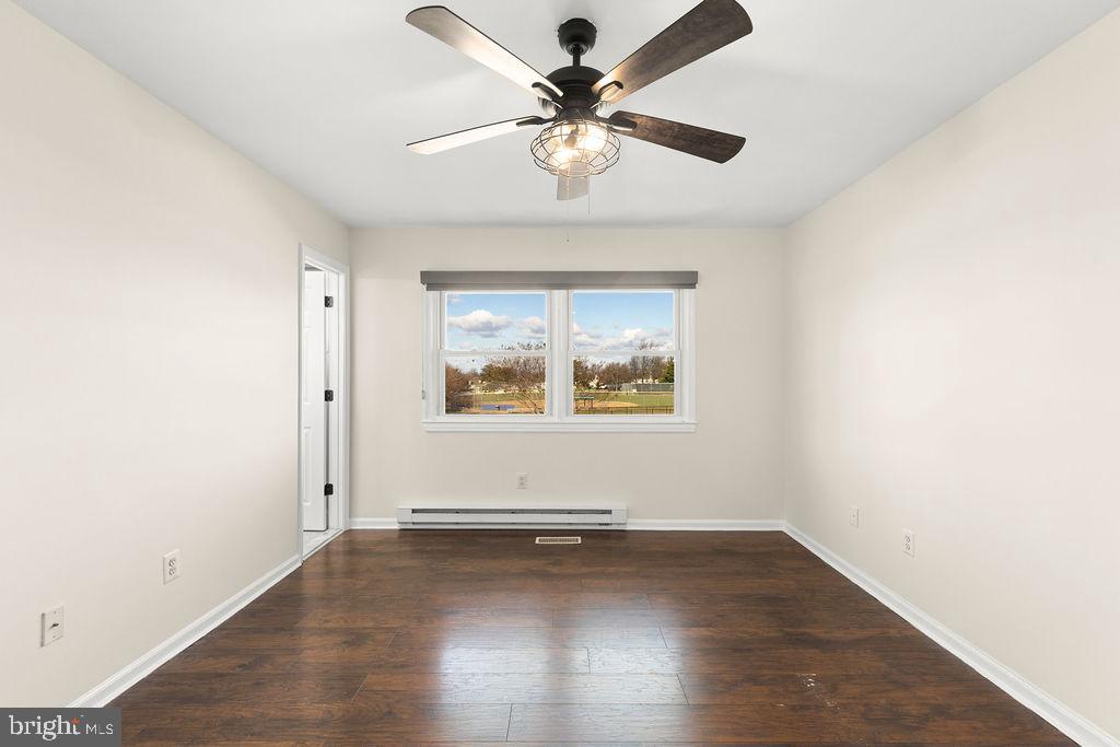 503 South Maple Court Sterling, VA 20164 - Photo 25 of 43 an empty room with wooden floor and windows