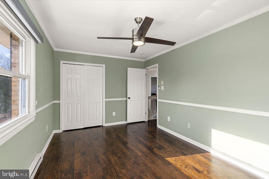 503 South Maple Court Sterling, VA 20164 - Photo 29 of 43 a view of empty room with wooden floor and window