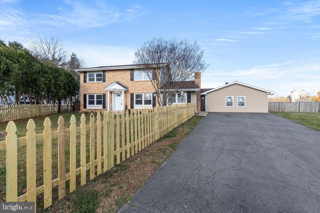 503 South Maple Court Sterling, VA 20164 - Photo 35 of 43 a view of a white house with a large yard and large trees