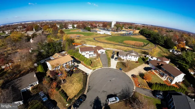 an aerial view of a house with yard swimming pool and outdoor seating