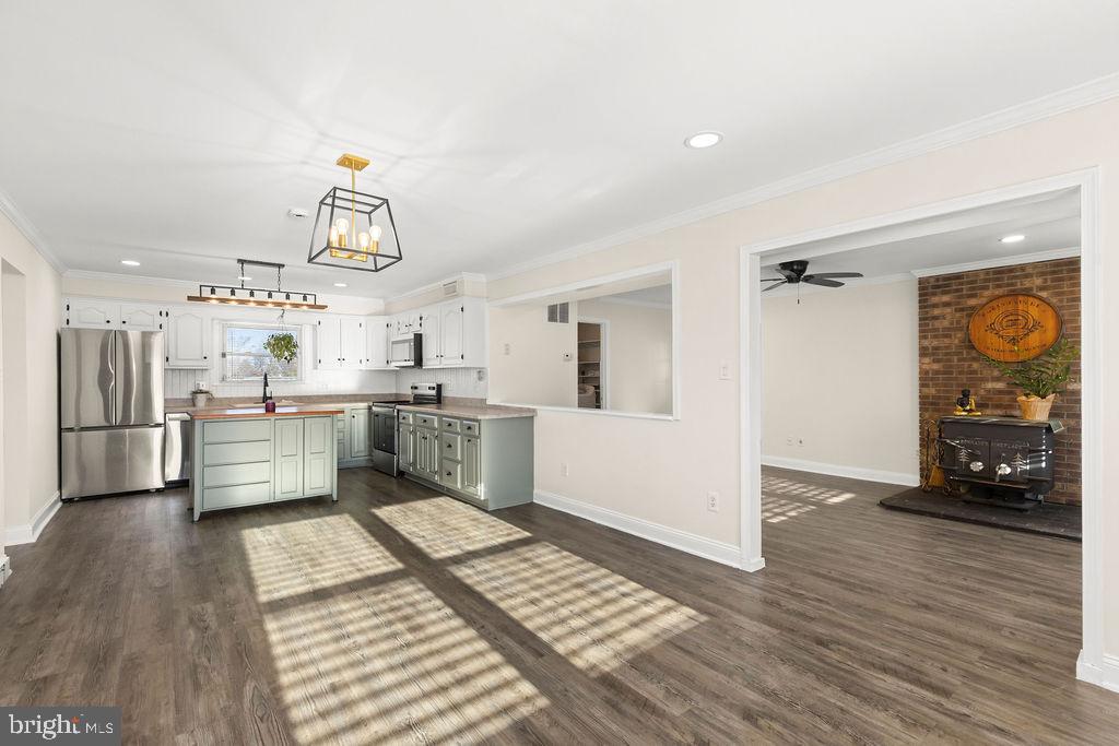 503 South Maple Court Sterling, VA 20164 - Photo 5 of 43 a kitchen with stainless steel appliances kitchen island granite countertop a refrigerator and a sink